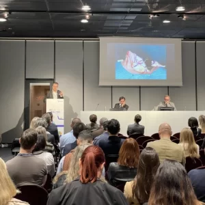 Dr. Göksel giving a presentation on nasal surgery techniques at an international conference.