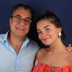 Dr. Göksel sharing a cheerful moment with a young female patient.