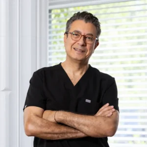 Dr. Abdülkadir Göksel wearing black surgical scrubs