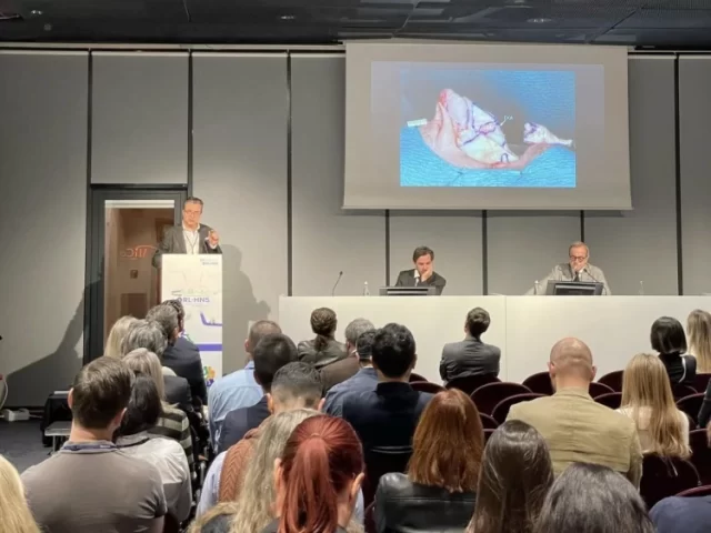 Dr. Göksel giving a presentation on nasal surgery techniques at an international conference.